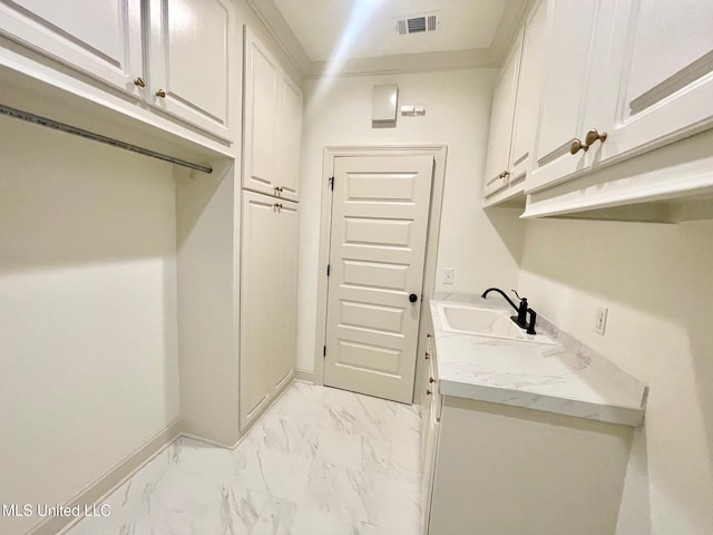 laundry area with sink