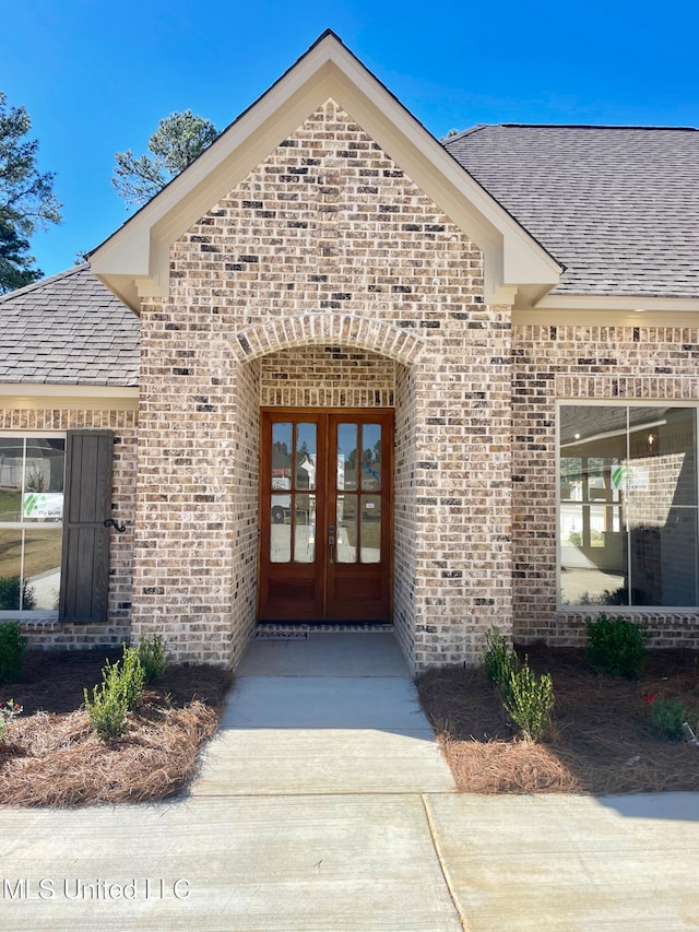 doorway to property featuring french doors