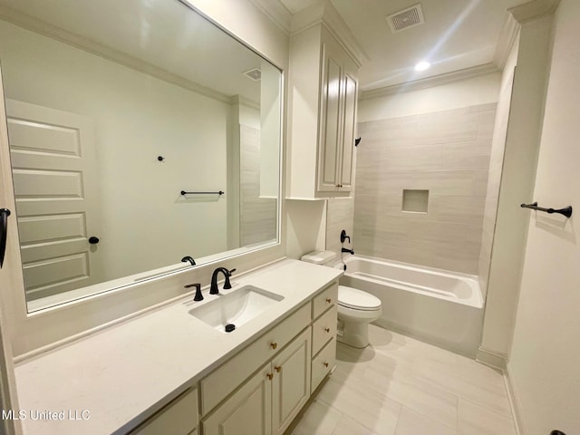 full bathroom featuring tiled shower / bath combo, tile patterned floors, crown molding, toilet, and vanity