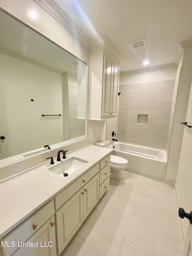 full bathroom with tiled shower / bath combo, tile patterned floors, toilet, vanity, and ornamental molding