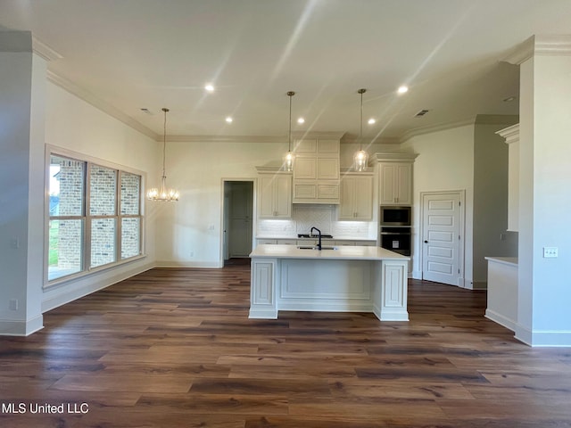 kitchen with dark hardwood / wood-style flooring, decorative light fixtures, black oven, and stainless steel microwave