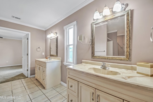 full bath featuring visible vents, two vanities, a sink, and ornamental molding