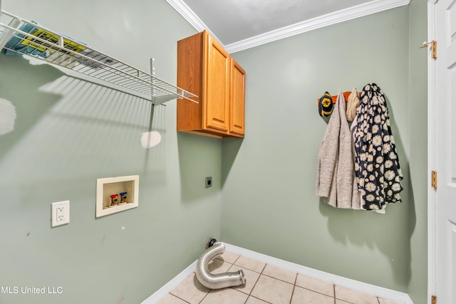 laundry area featuring cabinets, washer hookup, light tile patterned floors, electric dryer hookup, and crown molding