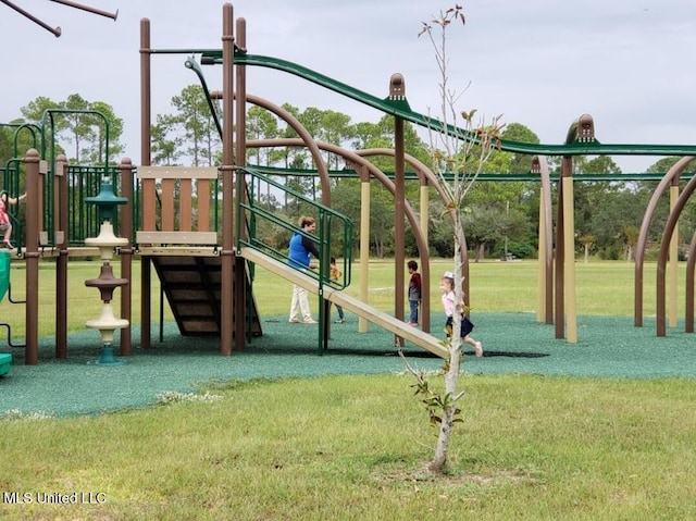 communal playground featuring a yard