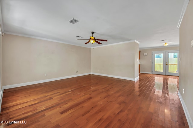 empty room featuring ornamental molding, french doors, wood-type flooring, and ceiling fan