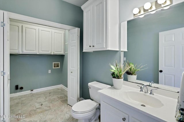 bathroom featuring toilet, marble finish floor, vanity, and baseboards