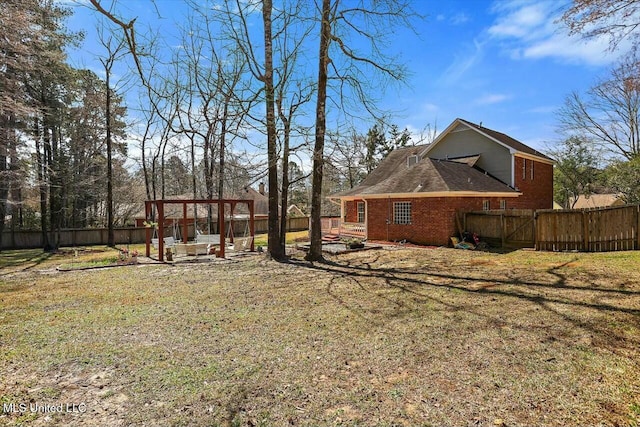 view of yard with an outdoor fire pit and fence