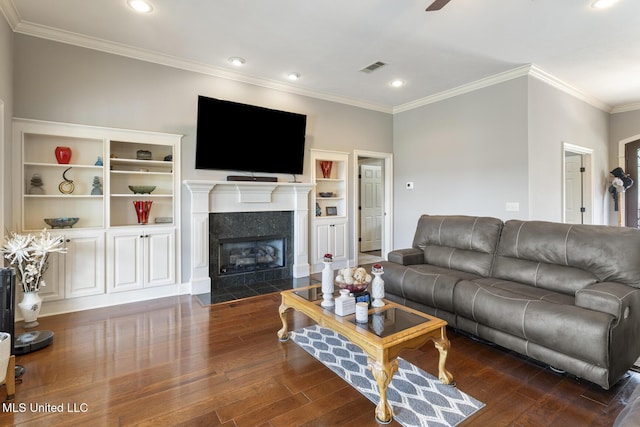 1600 Wright Rd, Raymond, MS 39154 - living area with crown molding, dark wood-style flooring, recessed lighting, a tiled fireplace, and ceiling fan