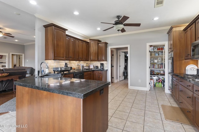 1600 Wright Rd, Raymond, MS 39154 - kitchen featuring a ceiling fan, a peninsula, tile counters, appliances with stainless steel finishes, and ornamental molding