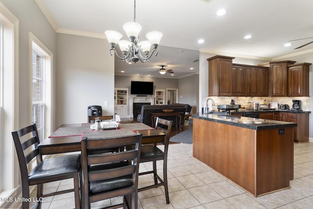 1600 Wright Rd, Raymond, MS 39154 - kitchen with ceiling fan, ornamental molding, decorative backsplash, a chandelier, and a sink