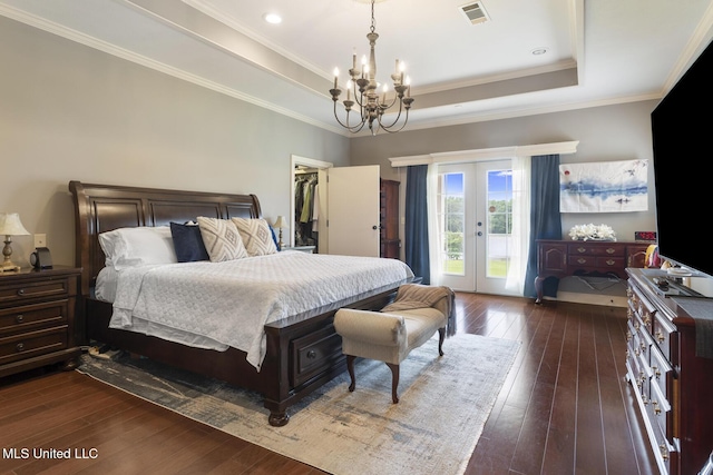 1600 Wright Rd, Raymond, MS 39154 - bedroom featuring a chandelier, dark wood-style flooring, access to outside, french doors, and a raised ceiling
