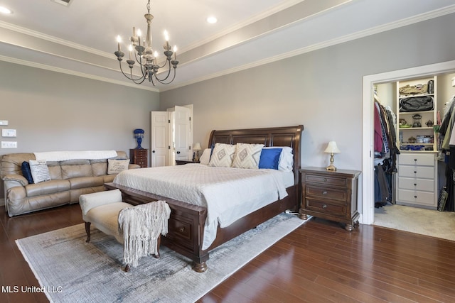 1600 Wright Rd, Raymond, MS 39154 - bedroom with a chandelier, hardwood / wood-style floors, crown molding, a tray ceiling, and a spacious closet