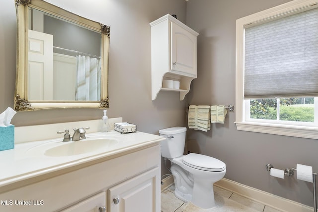 1600 Wright Rd, Raymond, MS 39154 - bathroom featuring toilet, vanity, tile patterned flooring, and baseboards