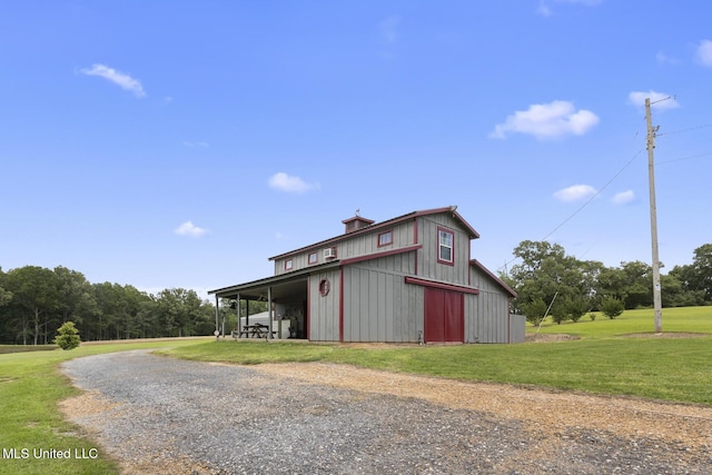 1600 Wright Rd, Raymond, MS 39154 - view of pole building featuring dirt driveway and a lawn