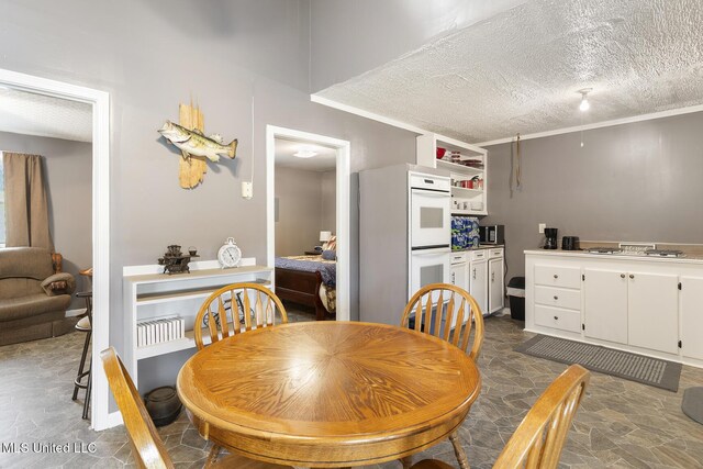 1600 Wright Rd, Raymond, MS 39154 - dining room featuring a textured ceiling and stone finish floors