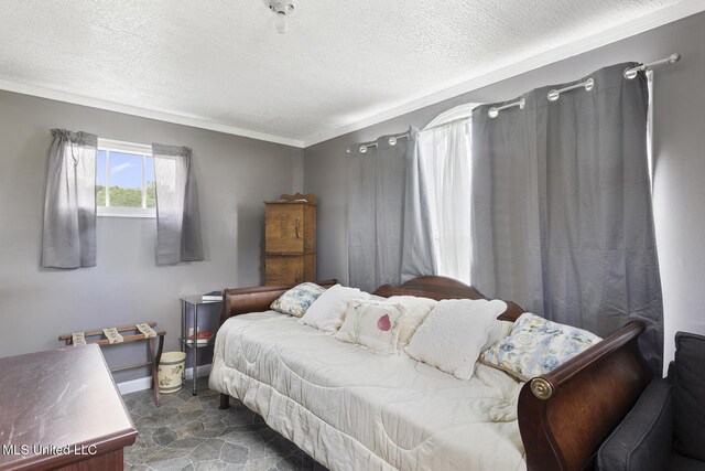 1600 Wright Rd, Raymond, MS 39154 - bedroom featuring a textured ceiling, ornamental molding, dark stone finish floors, and baseboards
