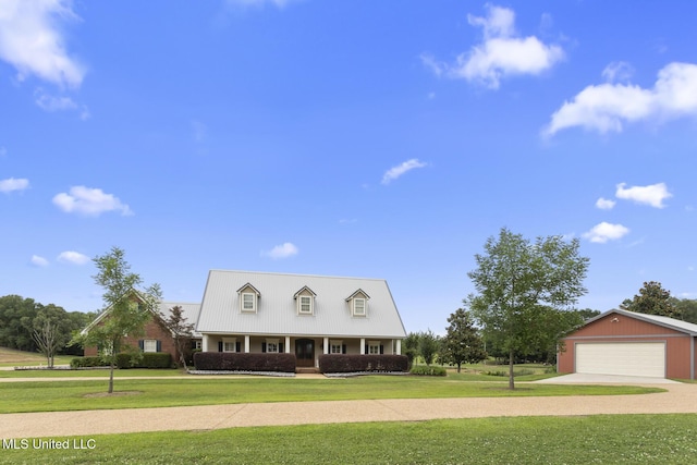 1600 Wright Rd, Raymond, MS 39154 - cape cod house featuring a front yard, driveway, a garage, and a porch