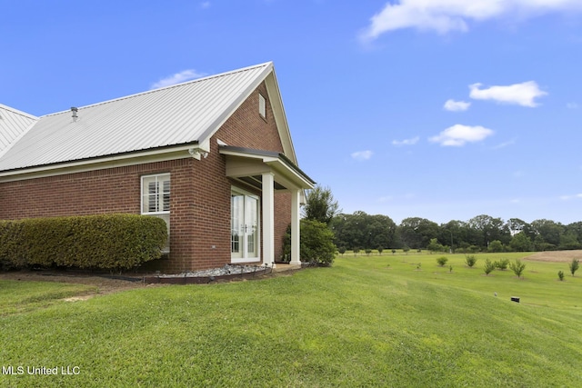 1600 Wright Rd, Raymond, MS 39154 - view of property exterior featuring brick siding, a yard, and metal roof