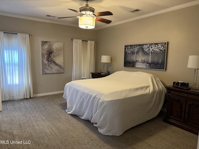 carpeted bedroom with baseboards, ceiling fan, visible vents, and crown molding