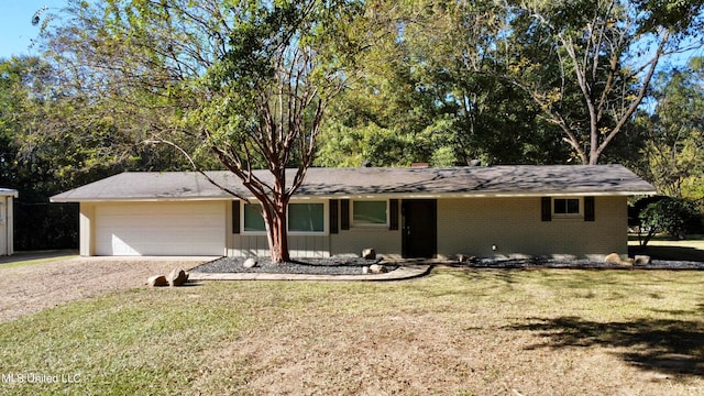 single story home with a front lawn and a garage