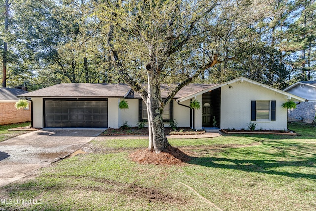 single story home featuring a garage and a front lawn