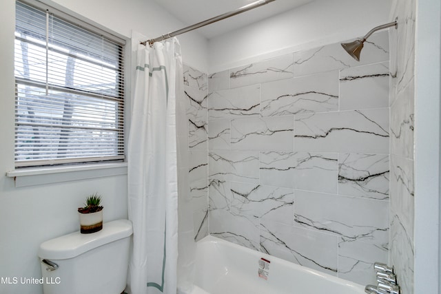 bathroom featuring toilet and shower / bathtub combination with curtain