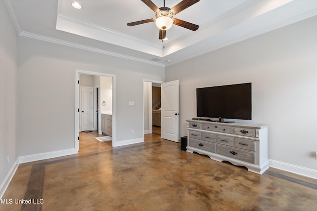 unfurnished bedroom featuring a raised ceiling, concrete flooring, ornamental molding, and ensuite bath