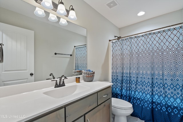 bathroom with toilet, a shower with shower curtain, vanity, and visible vents