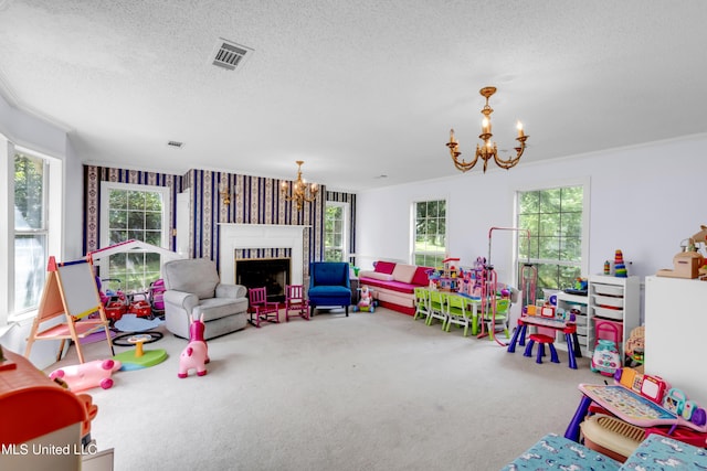 9618 Paige Bayou Rd, Vancleave, MS 39565 - recreation room featuring a chandelier, carpet floors, a fireplace, and a textured ceiling