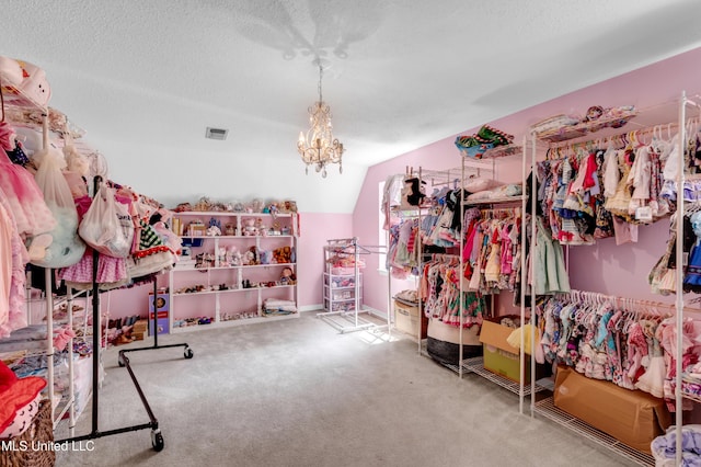 9618 Paige Bayou Rd, Vancleave, MS 39565 - spacious closet with lofted ceiling, a chandelier, and carpet floors