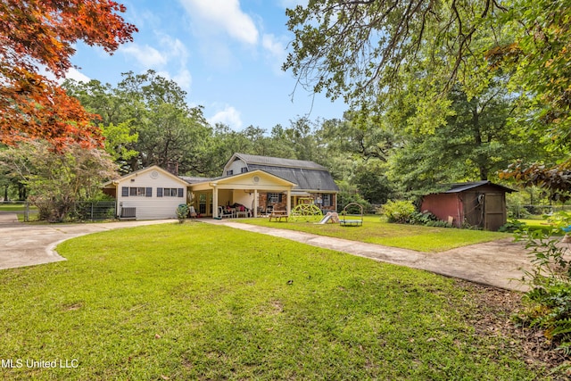 9618 Paige Bayou Rd, Vancleave, MS 39565 - view of front of home with concrete driveway, a porch, and view of wooded area