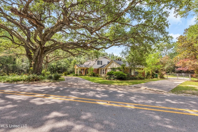 9618 Paige Bayou Rd, Vancleave, MS 39565 - view of front of property featuring driveway, a gate, and a chimney