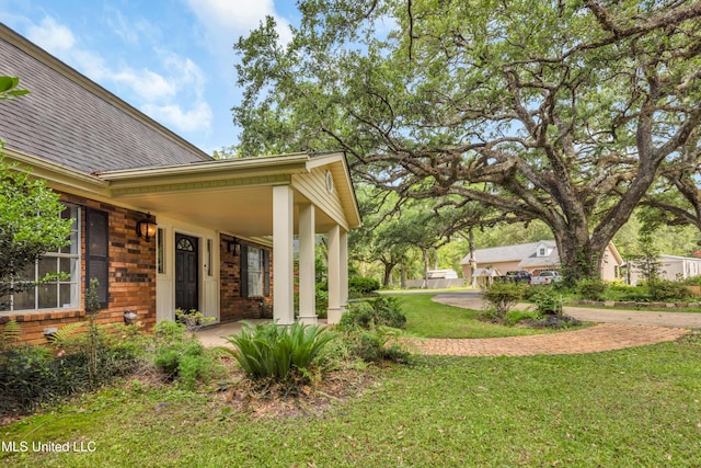9618 Paige Bayou Rd, Vancleave, MS 39565 - view of grassy yard with covered porch