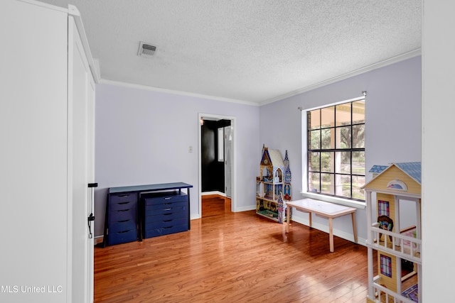 9618 Paige Bayou Rd, Vancleave, MS 39565 - misc room with a textured ceiling, wood finished floors, ornamental molding, and baseboards