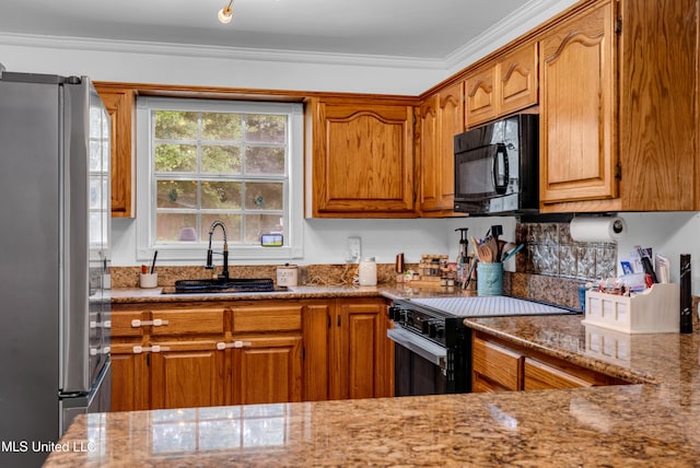 9618 Paige Bayou Rd, Vancleave, MS 39565 - kitchen featuring freestanding refrigerator, black microwave, electric range oven, a sink, and light stone countertops