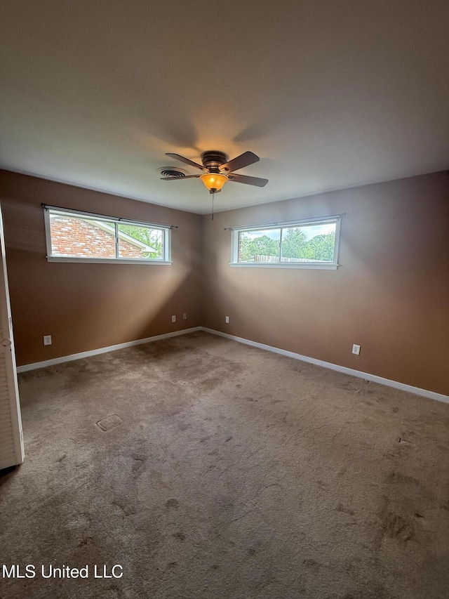 104 Mcgregor Way, Natchez, MS 39120 - spare room with baseboards, a ceiling fan, and carpet floors