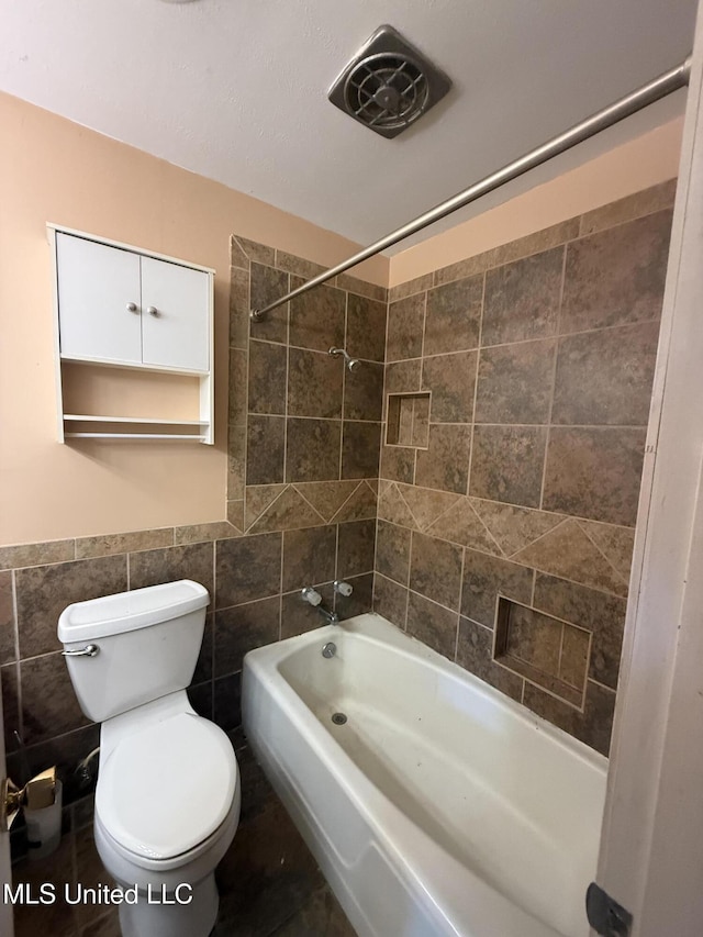 104 Mcgregor Way, Natchez, MS 39120 - full bathroom with shower / bath combination, a wainscoted wall, toilet, and tile walls
