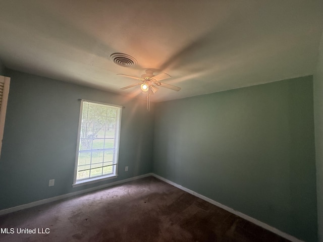 104 Mcgregor Way, Natchez, MS 39120 - empty room with visible vents, a ceiling fan, baseboards, and dark carpet
