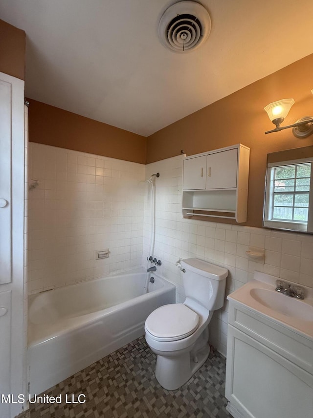 104 Mcgregor Way, Natchez, MS 39120 - full bath with visible vents, vanity, bathing tub / shower combination, toilet, and tile walls