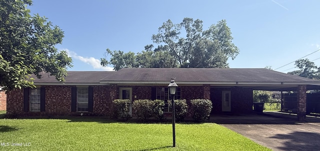 104 Mcgregor Way, Natchez, MS 39120 - ranch-style house featuring a front yard, a carport, driveway, and brick siding