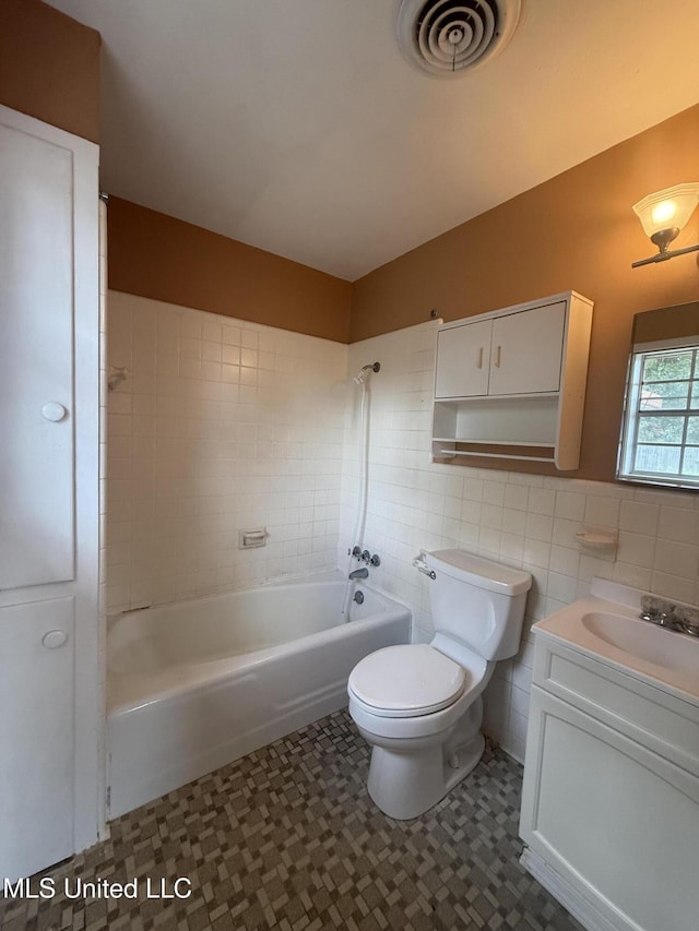 104 Mcgregor Way, Natchez, MS 39120 - full bathroom featuring visible vents, vanity, toilet, tile walls, and tile patterned floors