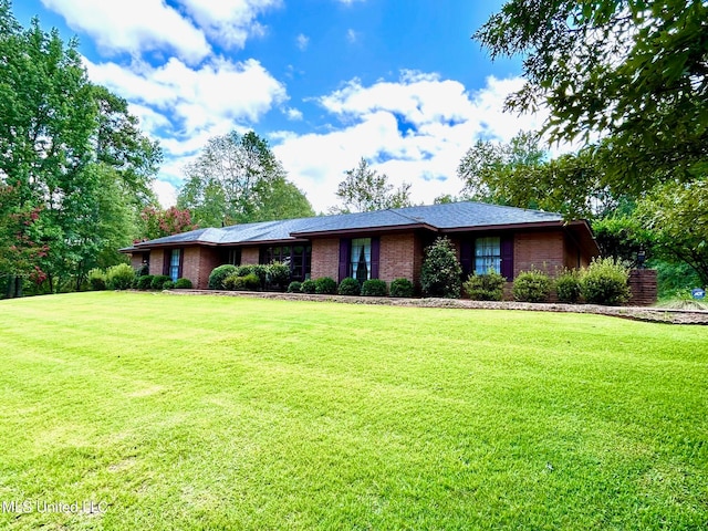 ranch-style house with a front yard