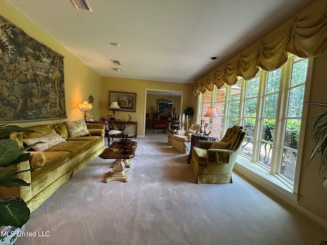 carpeted living room featuring a healthy amount of sunlight