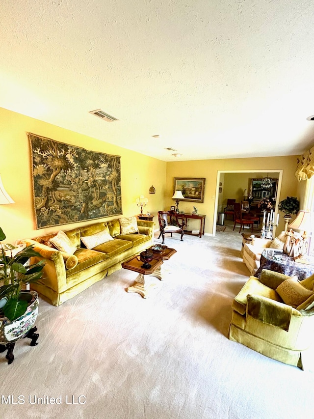 living room featuring a textured ceiling and carpet flooring