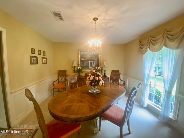 dining room with a chandelier