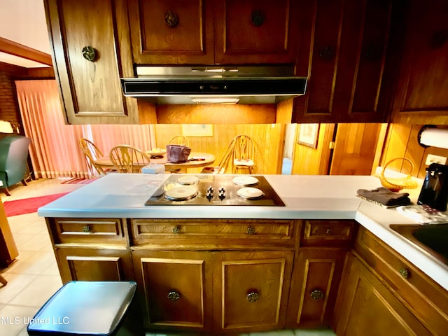 kitchen featuring black electric cooktop and light tile patterned floors