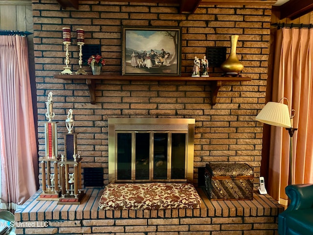 details featuring a brick fireplace