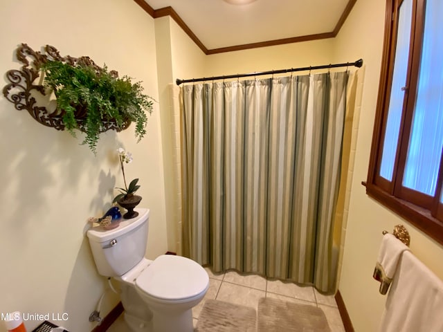 bathroom featuring ornamental molding, shower / tub combo with curtain, toilet, and tile patterned flooring