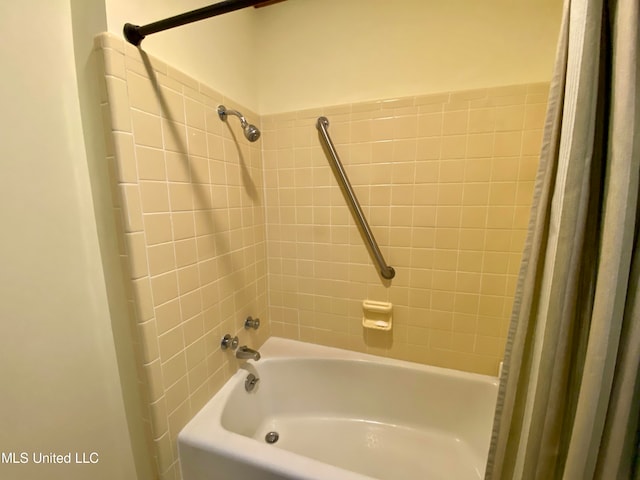 bathroom featuring shower / tub combo with curtain