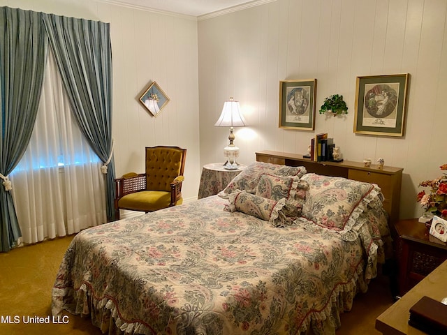 bedroom with crown molding, carpet floors, and wooden walls